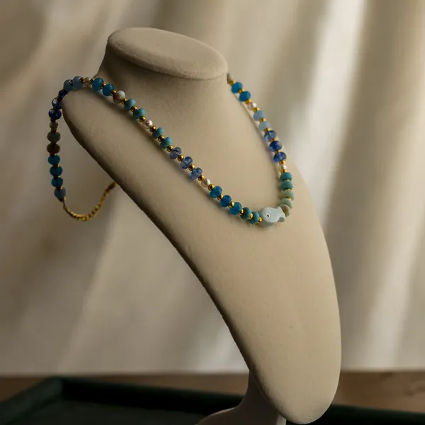 The Capri, colorful beads with a fish centerpiece